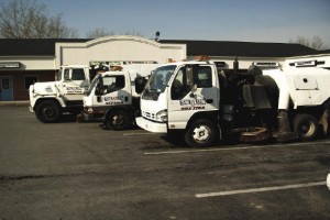 View of brush and vacuum on sweeper truck